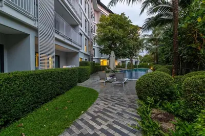 a courtyard of a building with a swimming pool at C241 2BR Pool Access 5 Min Walk to Rawai Beach in Rawai Beach