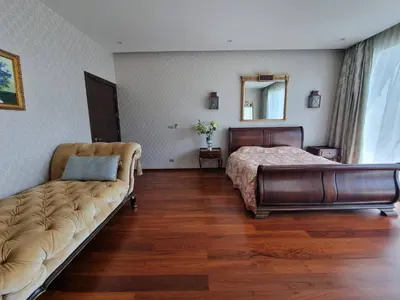 a bedroom with a bed and a couch in it at Luxury Villa with Panoramic Seaview, Private Pool in Ban Saiyuan (1)