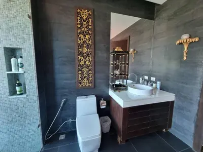 a bathroom with a sink and a toilet in it at Luxury Villa with Panoramic Seaview, Private Pool in Ban Saiyuan (1)