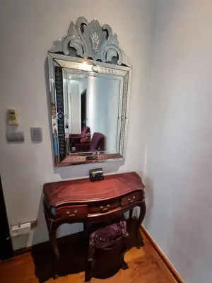 a dressing table with a mirror on a wall at Luxury Villa with Panoramic Seaview, Private Pool in Ban Saiyuan (1)