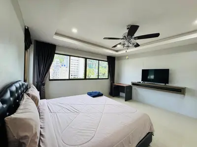 a bedroom with a bed and a ceiling fan at Patong Elite Condo Nanai, Patong, Phuket in Patong Beach