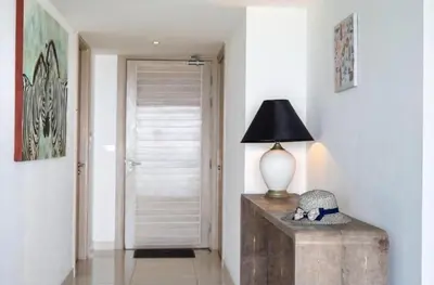 a lamp sitting on a wooden table in a hallway at Luxury Penthouse with Private Pool at View Phuket F9 in Karon Beach