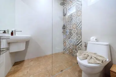 a bathroom with a toilet and a sink and a shower at Exclusive & Private! Elegant Two-Storey Pool Villa Anong in Kamala in Kamala Beach