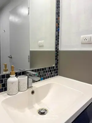 a bathroom sink with a mirror and a sink at Condo for rent chalong Rawai 610 in Ban Klang