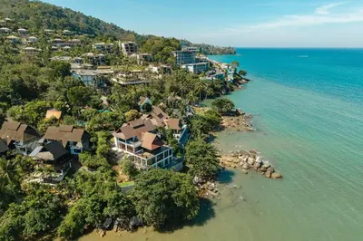 an aerial view of a resort on the shore of the water at 35 - Vast Beach Front Villa in Kamala Beach