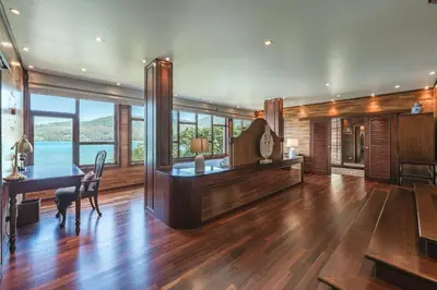 a living room with a table and a dining room at 35 - Vast Beach Front Villa in Kamala Beach