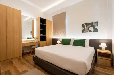 a bedroom with a large bed with a desk and a bed sidx sidx sidx sidx at Villa Asteria Krabi - Luxury 3 Bedroom Pool Retreat in Ao Nang in Ban Khlong Haeng