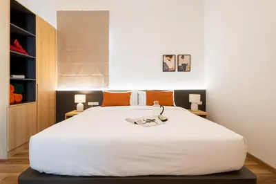 a bedroom with a large white bed and two lamps at Villa Asteria Krabi - Luxury 3 Bedroom Pool Retreat in Ao Nang in Ban Khlong Haeng