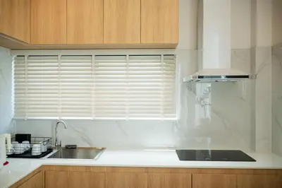 a kitchen with a sink and a window with blinds at Villa Asteria Krabi - Luxury 3 Bedroom Pool Retreat in Ao Nang in Ban Khlong Haeng