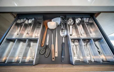 a drawer filled with utensils in a kitchen at BangTao Luxury 5 Bedroom 1200sqm Modern Bali Style Holiday Villa Quiet and Private Large Private Pool Large Garden in Bang Tao Beach
