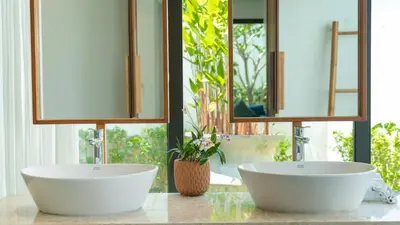 two sinks on a counter in a bathroom with mirrors at BangTao Luxury 5 Bedroom 1200sqm Modern Bali Style Holiday Villa Quiet and Private Large Private Pool Large Garden in Bang Tao Beach