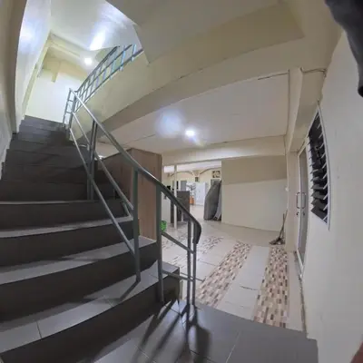 a spiral staircase in a house with a staircase at Vista Inn Patong in Patong Beach