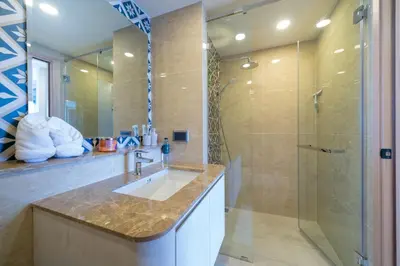 a bathroom with a sink and a shower at Ozone Condominium BangTao Laguna Area in Phuket