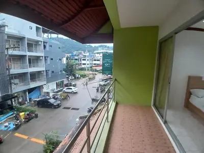 a balcony with a view of a city street at Didim Guest House Patong in Patong Beach
