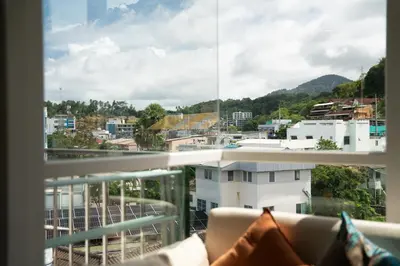 a view of a city from a balcony at 1 BR Suite 8-198 at Ozone Condo near Kata beach and surf in Kata Beach