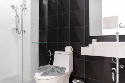 a bathroom with a toilet and a sink at 1 BR Suite 8-198 at Ozone Condo near Kata beach and surf in Kata Beach