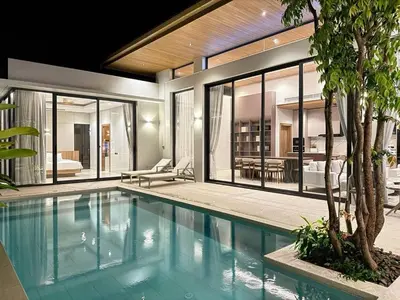 a swimming pool in a house with a living room at 4 Br Pool Villa in Chalong in Phuket Town