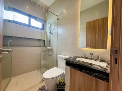 a bathroom with a shower and a toilet and a sink at 4 Br Pool Villa in Chalong in Phuket Town