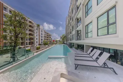an empty swimming pool in the middle of a building at Brand new 1 BR apt 403 at Space Condo near Boat Avenue in Bang Tao Beach