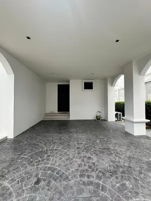 an empty room with a stone floor and white walls at Fifth Element Pool Villa By Ere in Laguna Phuket