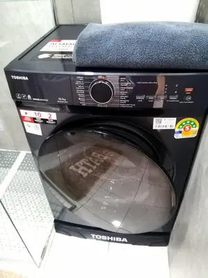a washing machine with a towel on top of it at Relife apartments Большая квартира с панорамным видом на горы на Най Харне in Phuket Town