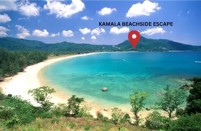 a beach with a red marker in the water at The Escape Kamala in Kamala Beach