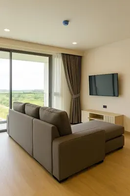 a living room with a couch and a flat screen tv at The Ozone Condominium 2 bedroom by Search Estate in Phuket Town