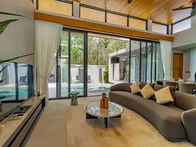 a living room with a couch and a tv at NEW Cozy 3BR Luxury Pool Villa - Villa Nova in Ban Pak Lak