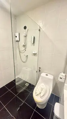 a shower stall with a toilet in a bathroom at Abdullah Residence in Patong Beach