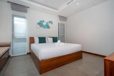 a bedroom with a large bed in a room at Nicky Luxury Private Pool Villa in BangTao Laguna in Laguna Phuket