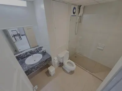 a bathroom with a toilet and a sink at WIVA by Woytuk in Patong Beach