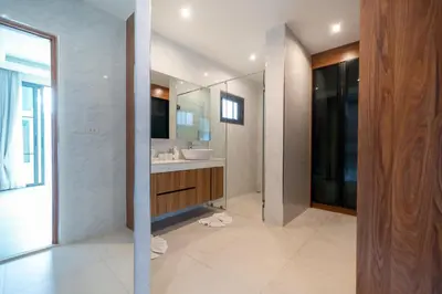 a bathroom with a sink and a mirror at Luxury 3BR Pool Villa Relaxation in BangTao Laguna in Laguna Phuket
