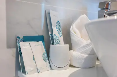 a shelf with toiletries on a counter next to a sink at Luxury 3BR Pool Villa Relaxation in BangTao Laguna in Laguna Phuket