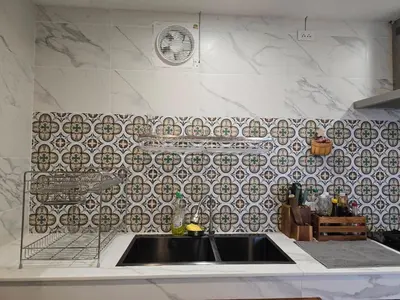 a kitchen with a sink and a tile wall at The Simple Place - King and Twin in Klong Muang Beach