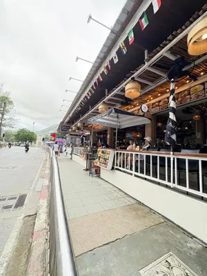 a restaurant on the side of a street at Island Patongbeach Apartments in Patong Beach