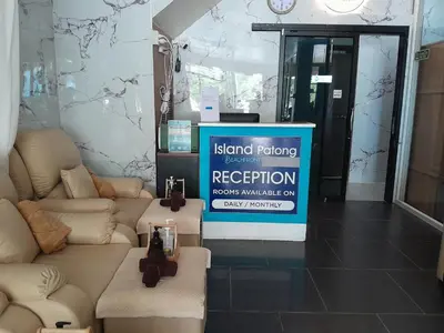a room with a sign that reads kent factors reception at Island Patongbeach Apartments in Patong Beach
