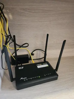 a black electronic device with wires on the floor at Cozy Palm Haven apartment in Kathu