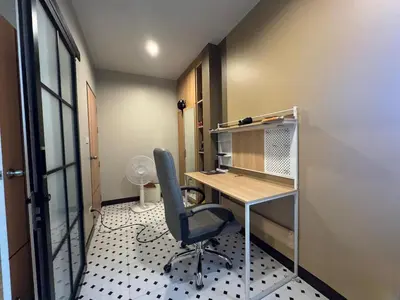 an office with a desk and a chair in a room at Rare Find Penthouse with Private Office and Jungle Mountrain Views in Kamala Beach