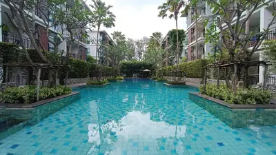 a swimming pool in the middle of a building at The Title Rawai Beach Front 1bdr in Rawai Beach