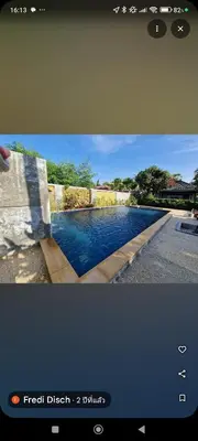 a tv screen with a picture of a swimming pool at Rawai Boutique Resort in Rawai Beach
