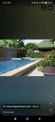 a television screen with a picture of a swimming pool at Rawai Boutique Resort in Rawai Beach