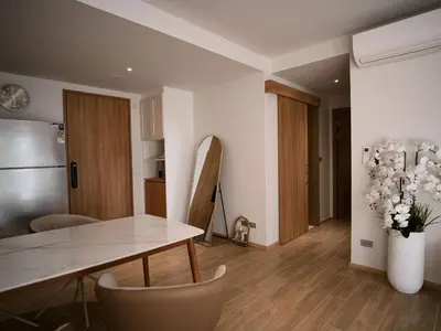 a kitchen and dining room with a table and chairs at Bang Tao - Laguna Beachside 3BR Apartment 130 sq m in Bang Tao Beach
