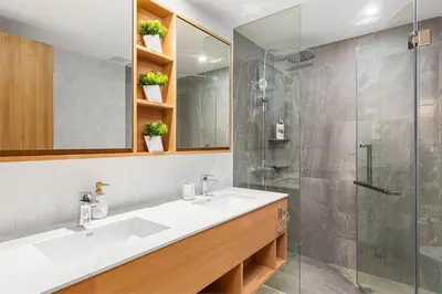 a bathroom with a sink and a shower at Bang Tao - Laguna Beachside 3BR Apartment 130 sq m in Bang Tao Beach