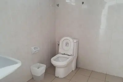 a bathroom with a toilet with the lid up at Wow Boutique Patong in Patong Beach