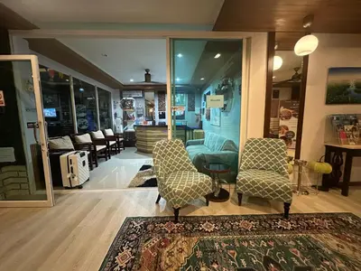 a store with two chairs and a rug in a room at Patong gray house in Patong Beach