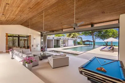 an open living room with a pool table at Villa Cielo in Ban Han Pa To