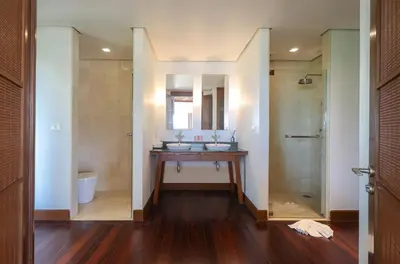 a bathroom with a sink and a mirror at Katamanda Villa Allegra 5 bedroom Seaview villa in Ban Karon