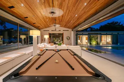 a pool table in the middle of a house at Villa Essenza in Ban Han Pa To