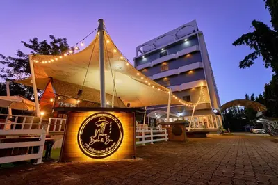 a building with a tent in front of it at night at Nora Bukit Hotel in Ban Sam Kong
