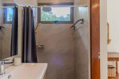 a bathroom with a shower with a sink and a mirror at V255 Huge Brand-New 7BR Pool Villa Rooftop View in Kata Beach